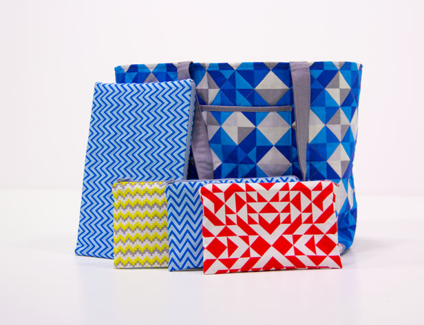 Small zipped pocket and a handbag made of fabrics with angular patterns in blue, red, yellow, etc.