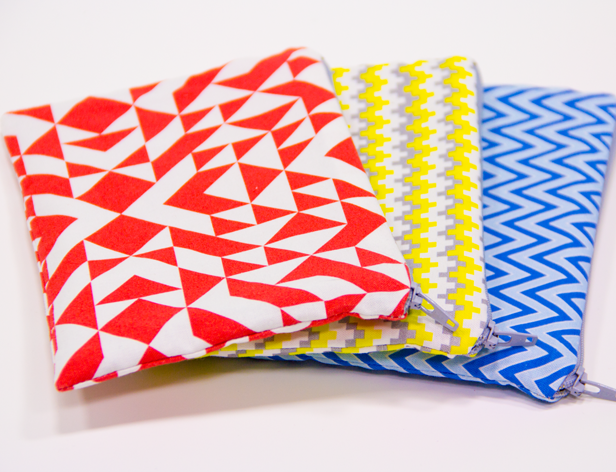 small pockets with zipper made of angle pattern fabrics in red, white, yellow, and blue
