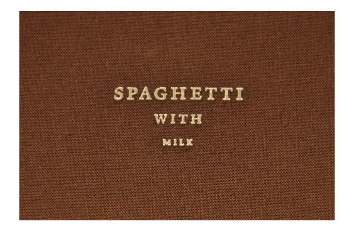 Spaghetti with milk cover made of brown fabric material