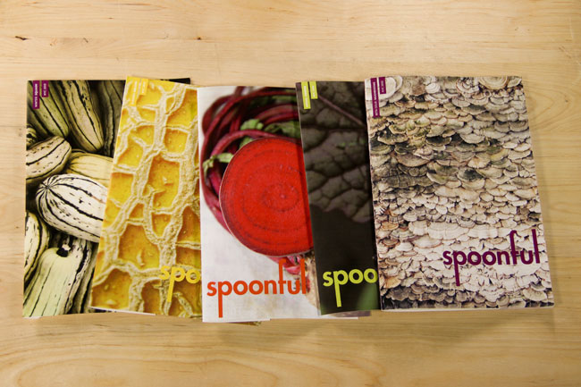 spoonful books arranged on a table with different fruits and vegetables on the cover