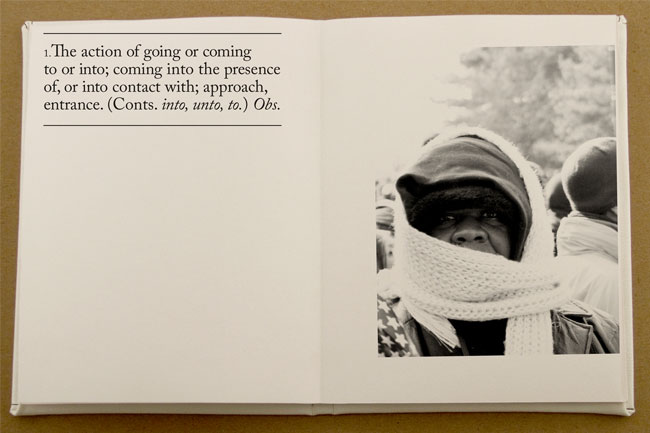 An opened book with a short text on the left page and a photo of a man with mouth covered with a scarf