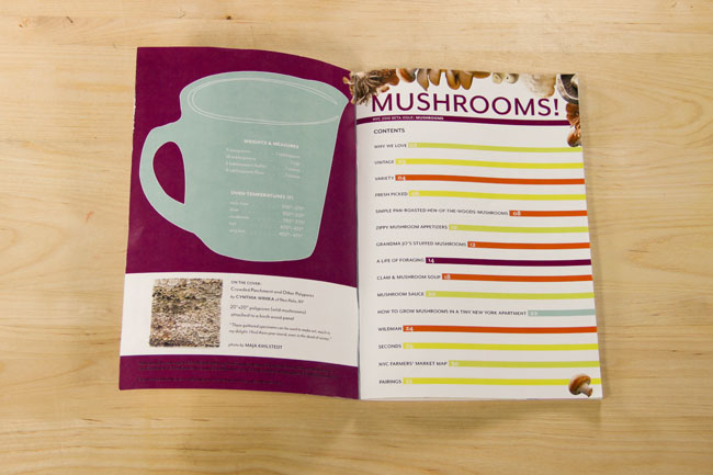 an opened book with a classification of mushrooms and a measuring cup