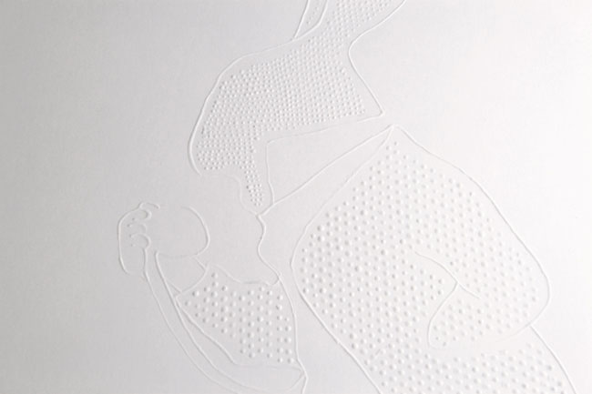 a bunny shape embossed on a white wall