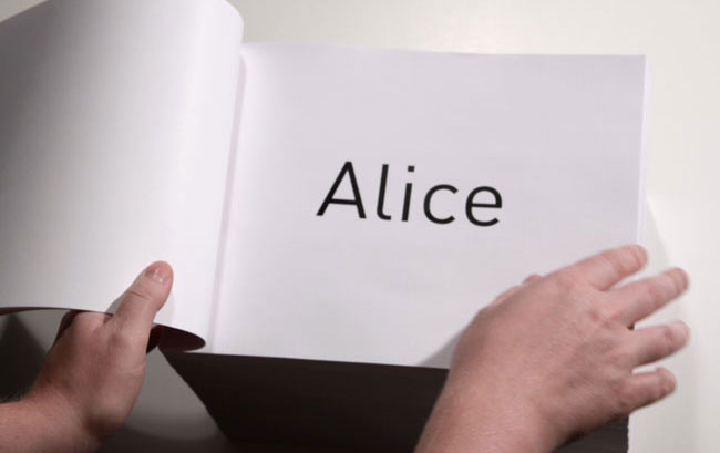 the name Alice is written on a white page of a book