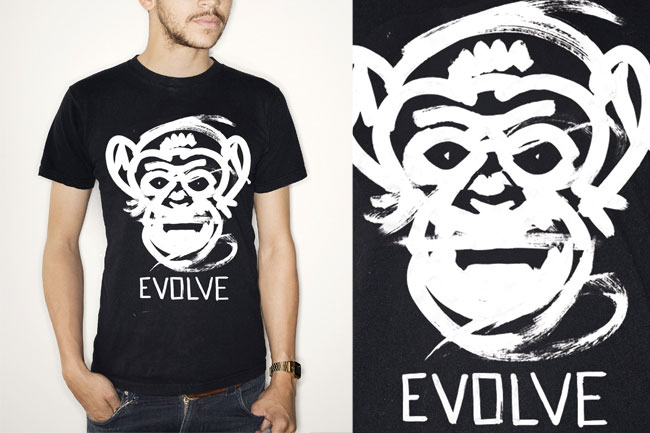 a line drawn monkey face with rounded white lines with the EVOLVE word under it paled on a t-shirt