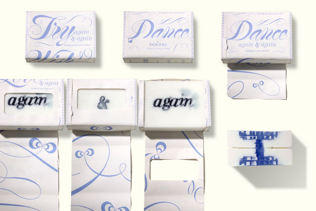 soap bars packed in white paper with blue calligraphy and graphics, and soaps have the words again & again written on them