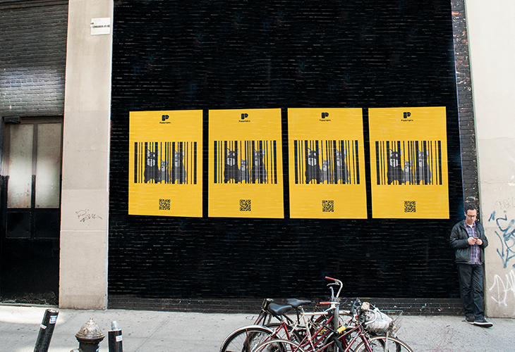 four yellow posters installed on a black wall