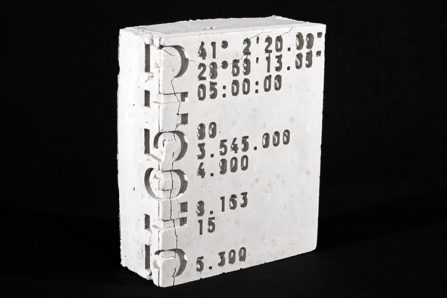 a concrete box with numbers on it