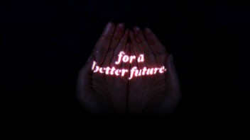 for a better future banner with the text glowing in red over two hands kept close together in a dark scene