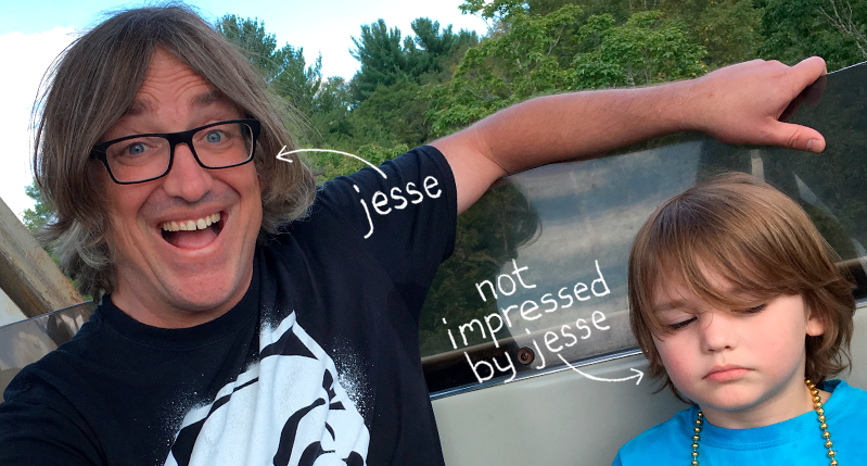 a photo of a man and a child with arrows pointing to the man's name Jesse and the other arrow pointing to the kid as " not impressed by Jesse"