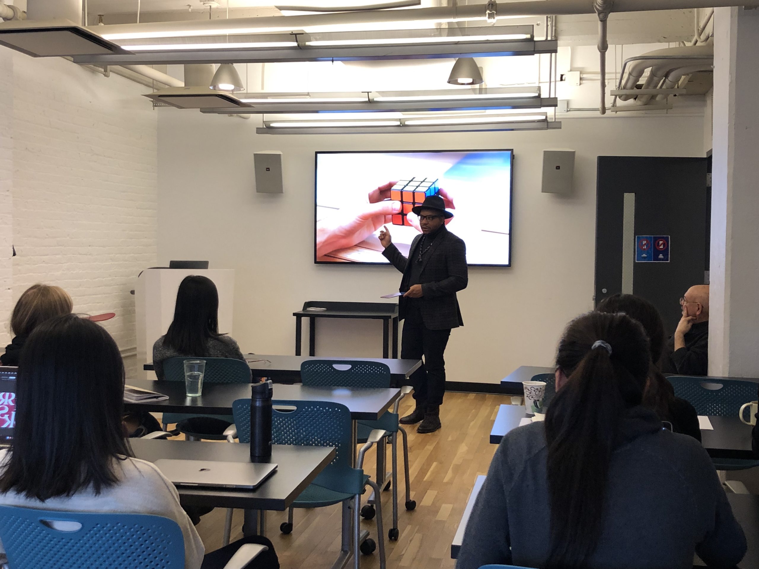 Douglas Davis guest lecture in front of a slide