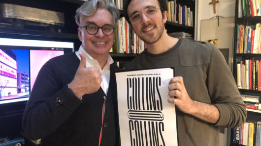 Brian Collins with a student holding a poster