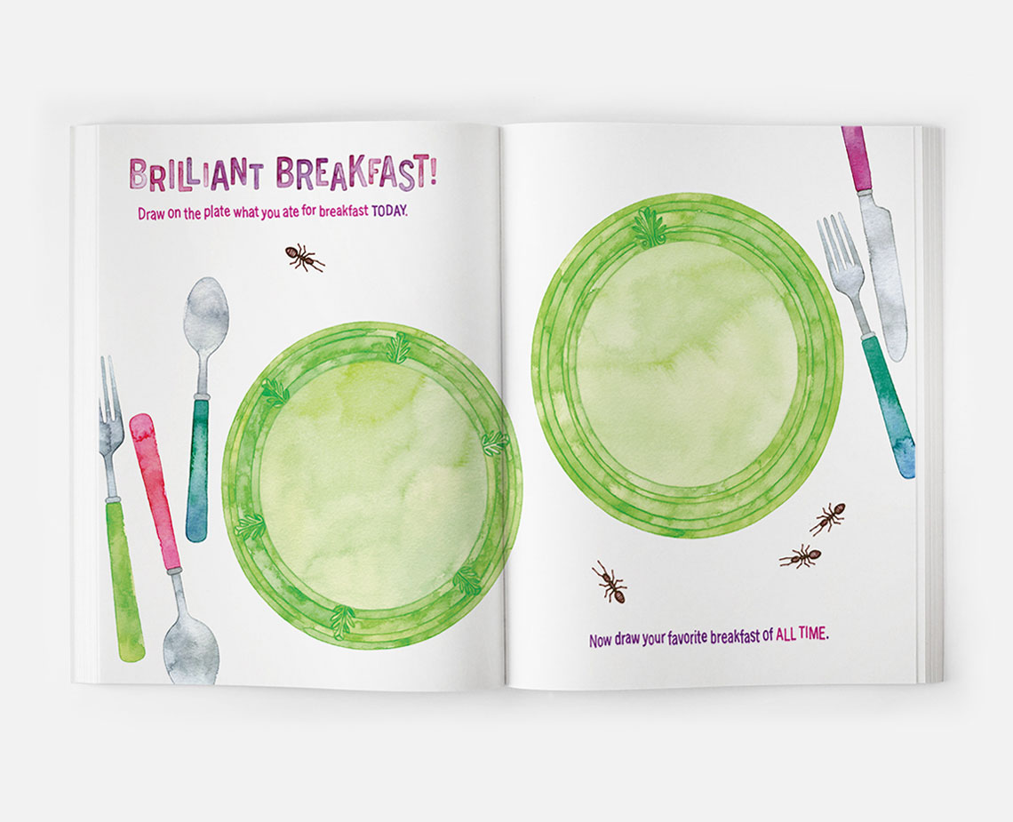 Hila cook book with green plates and forks and spoons