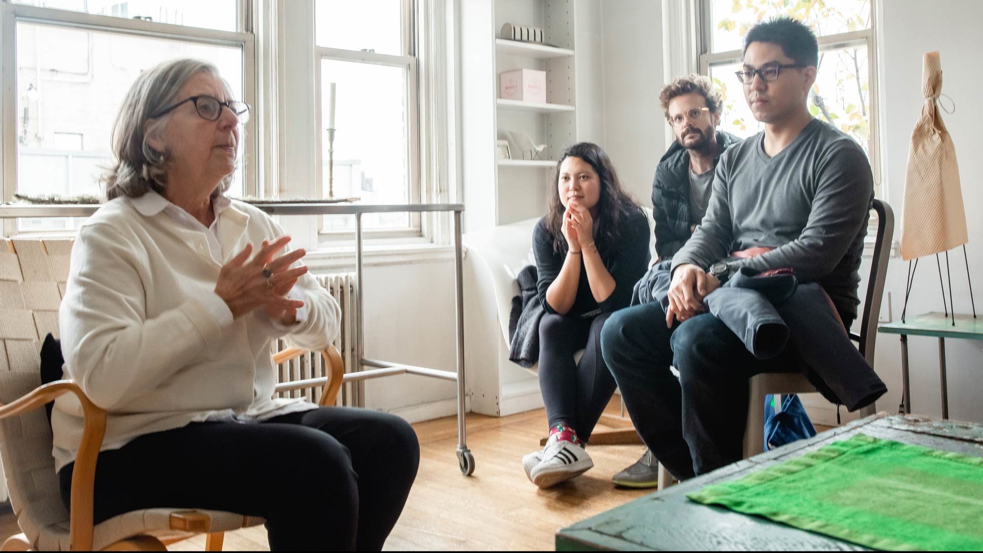 Maira Kalman in her apartment with students