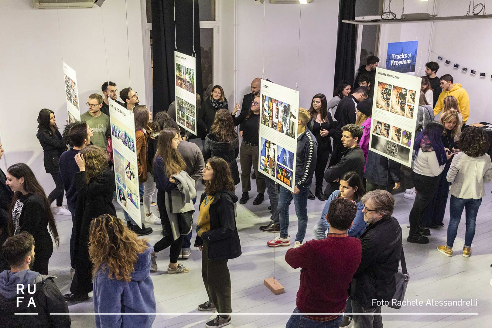 people looking at work in a gallery