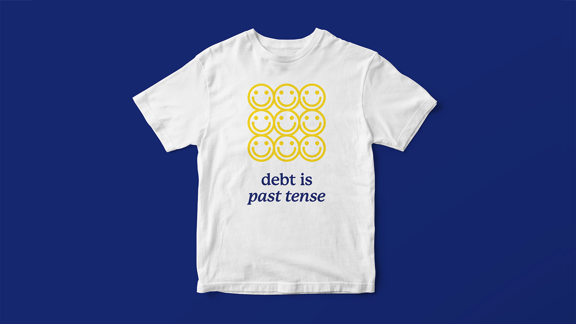 See Saw t-shirt, smiley faces with type that reads "debt is past tense"