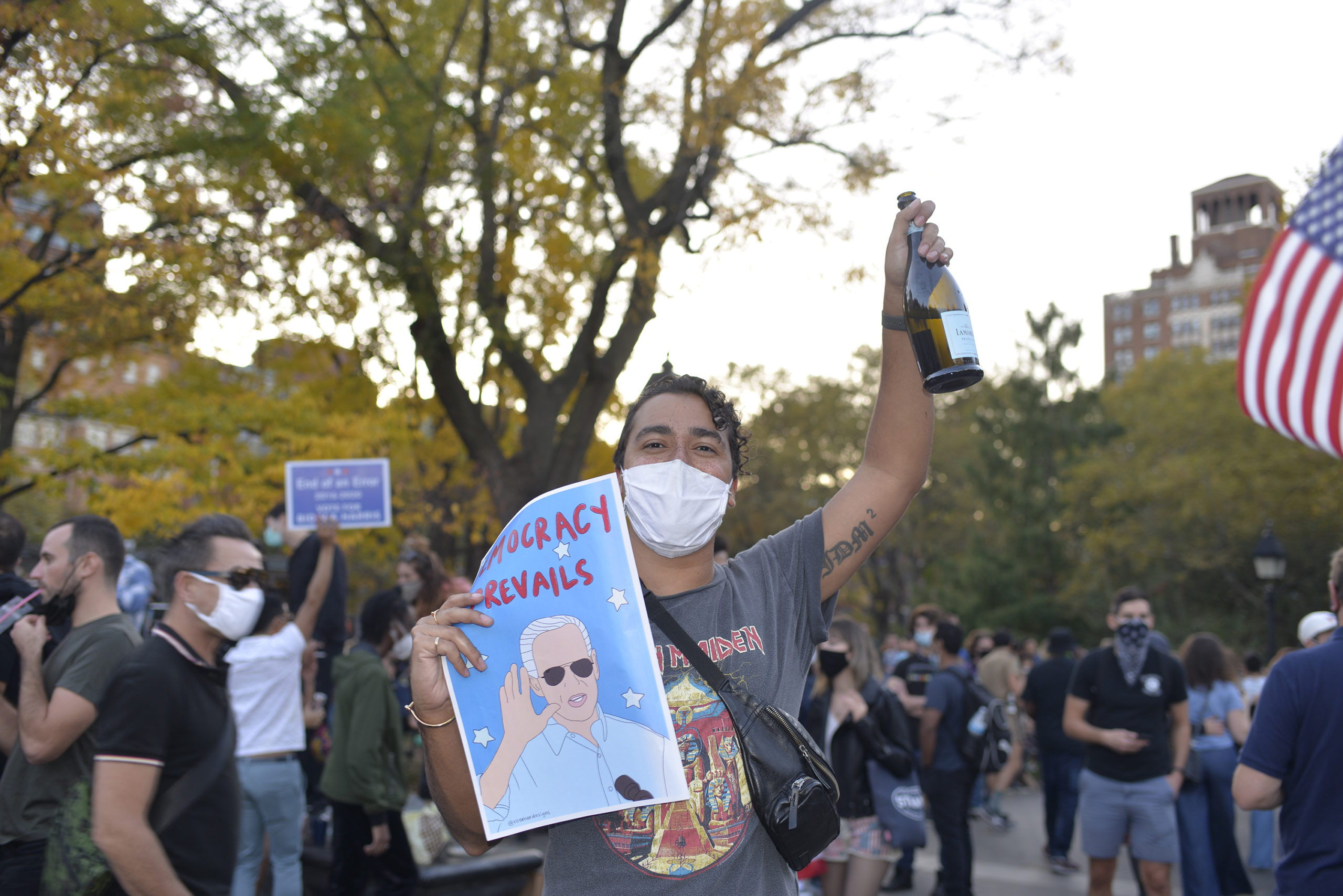 A man Joe Biden poster with a Champagne