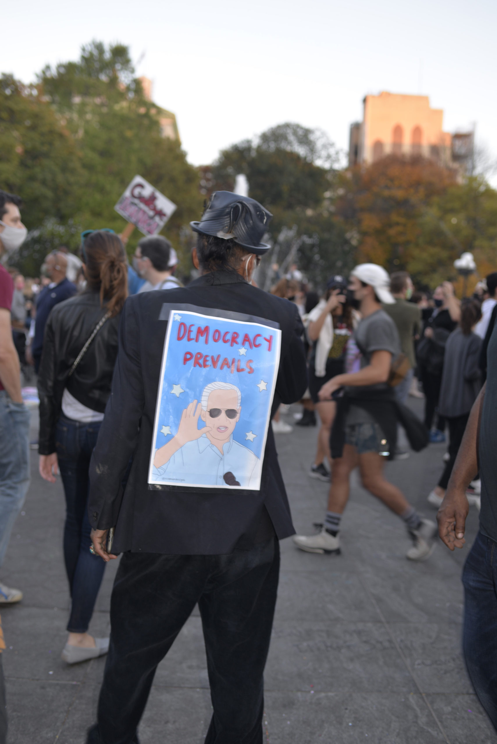 Joe Biden poster on someone's back taped