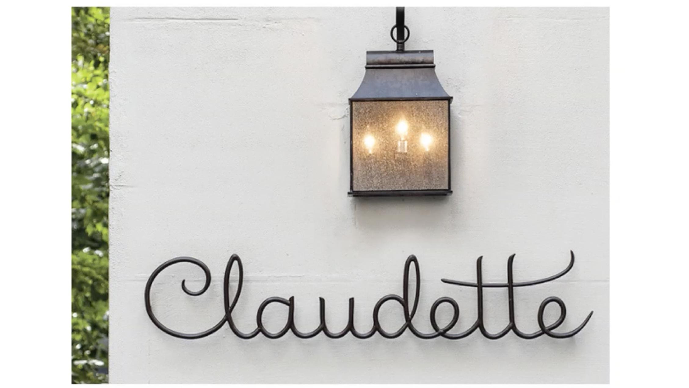 metal sign for Claudette restaurant