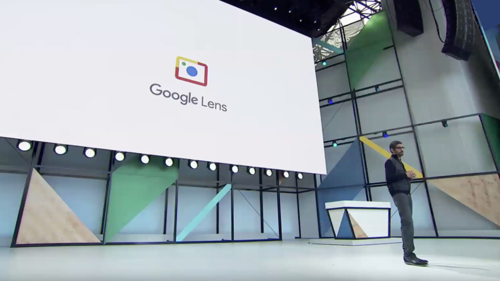 Robert Wong google lens branding with man on stage