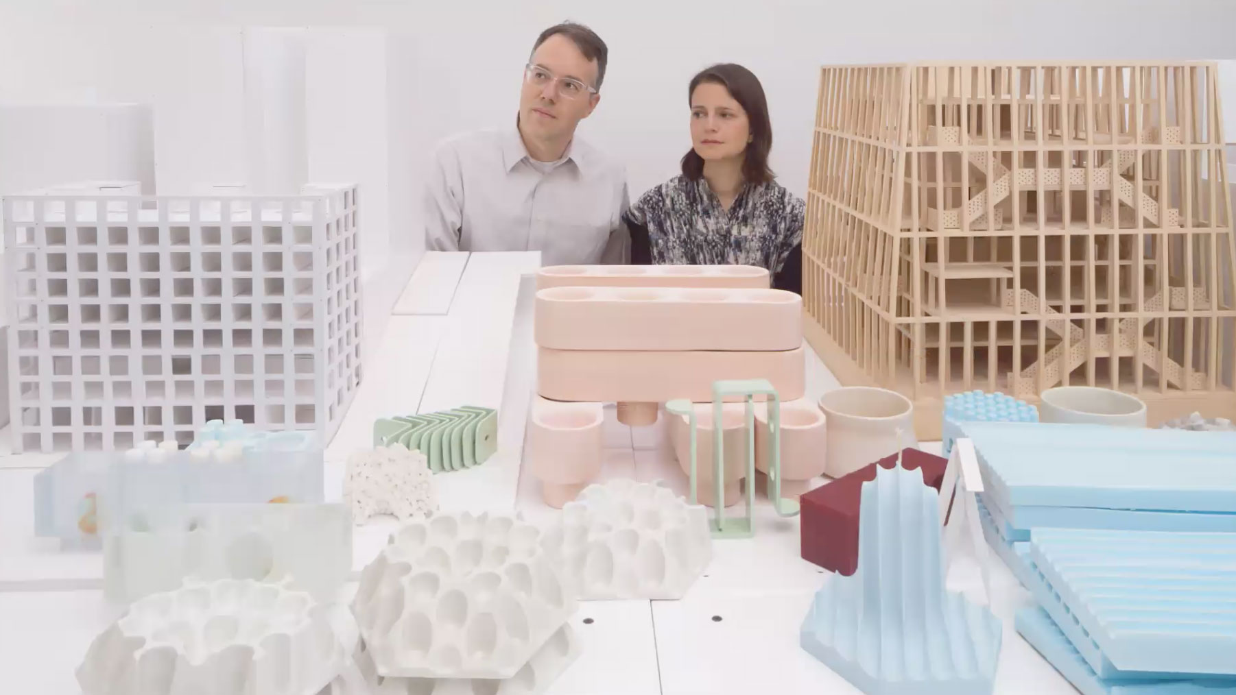 a man and a woman with architecture prototypes