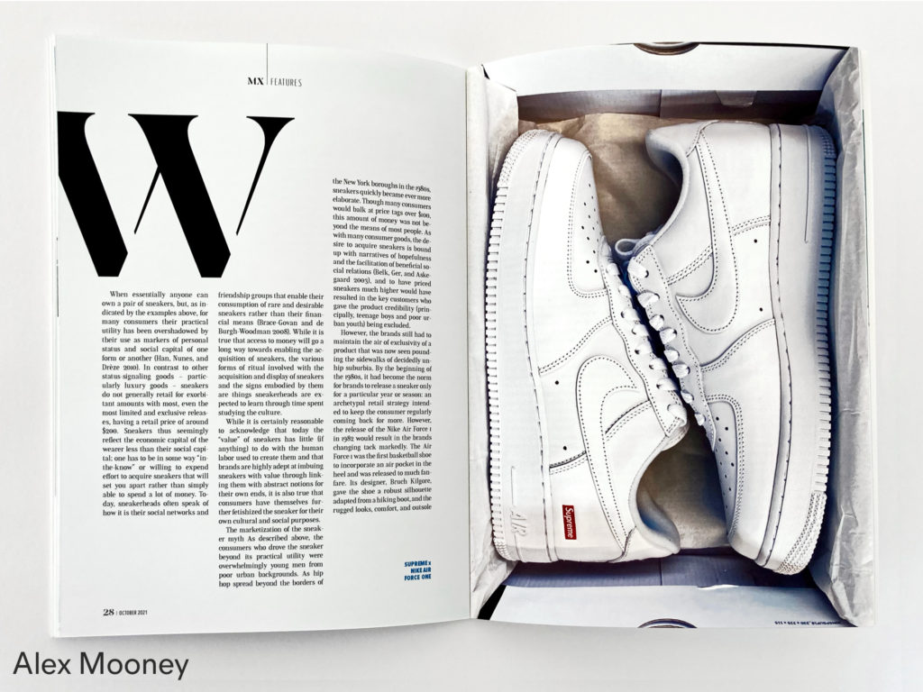 Spread of a magazine with text on the left page and a photo of white shoes on the right, by Alex Mooney