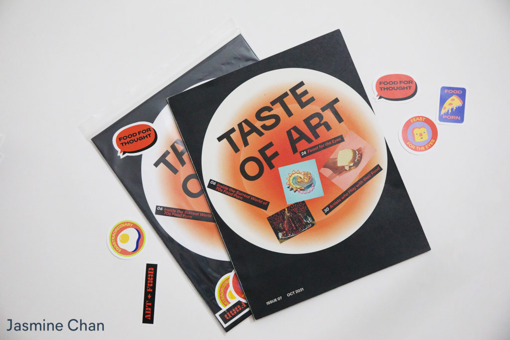 Magazine cover in orange and black. titled Taste Of Art, by Jasmine Chan