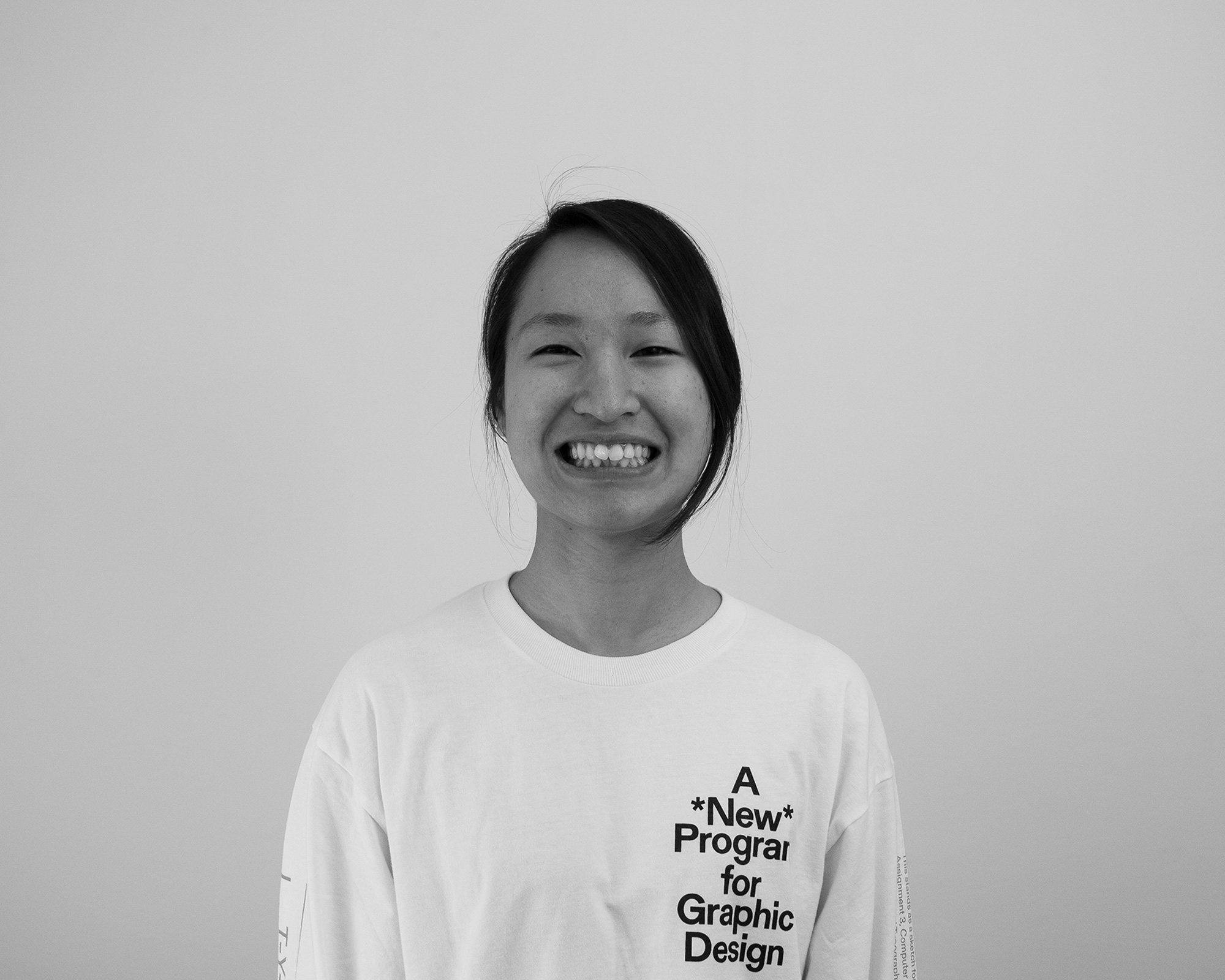A black and white photo of a woman wearing a blouse with the text: A *New* Program for Graphic Design.