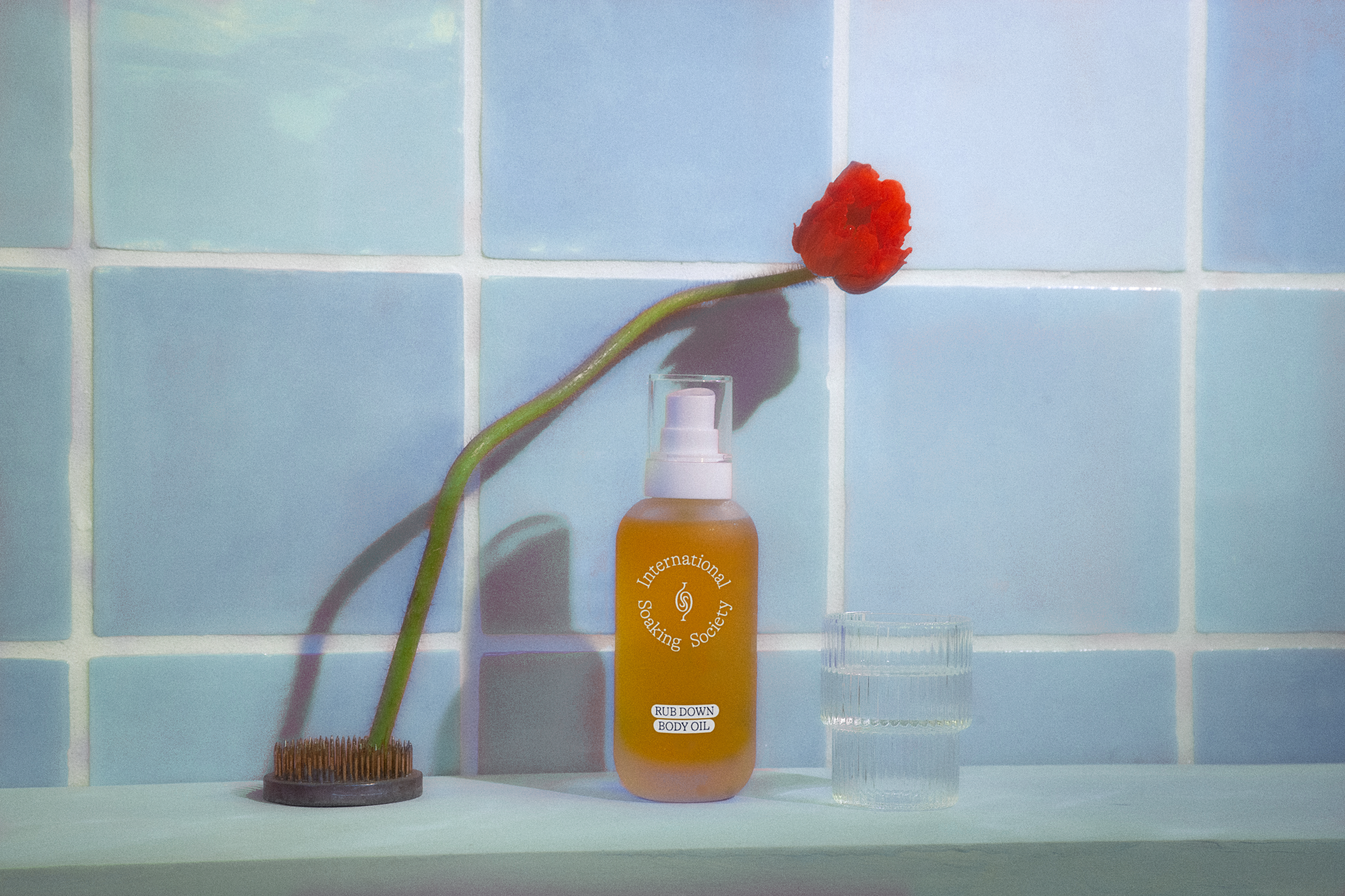 lotion bottle in a bathroom with flower