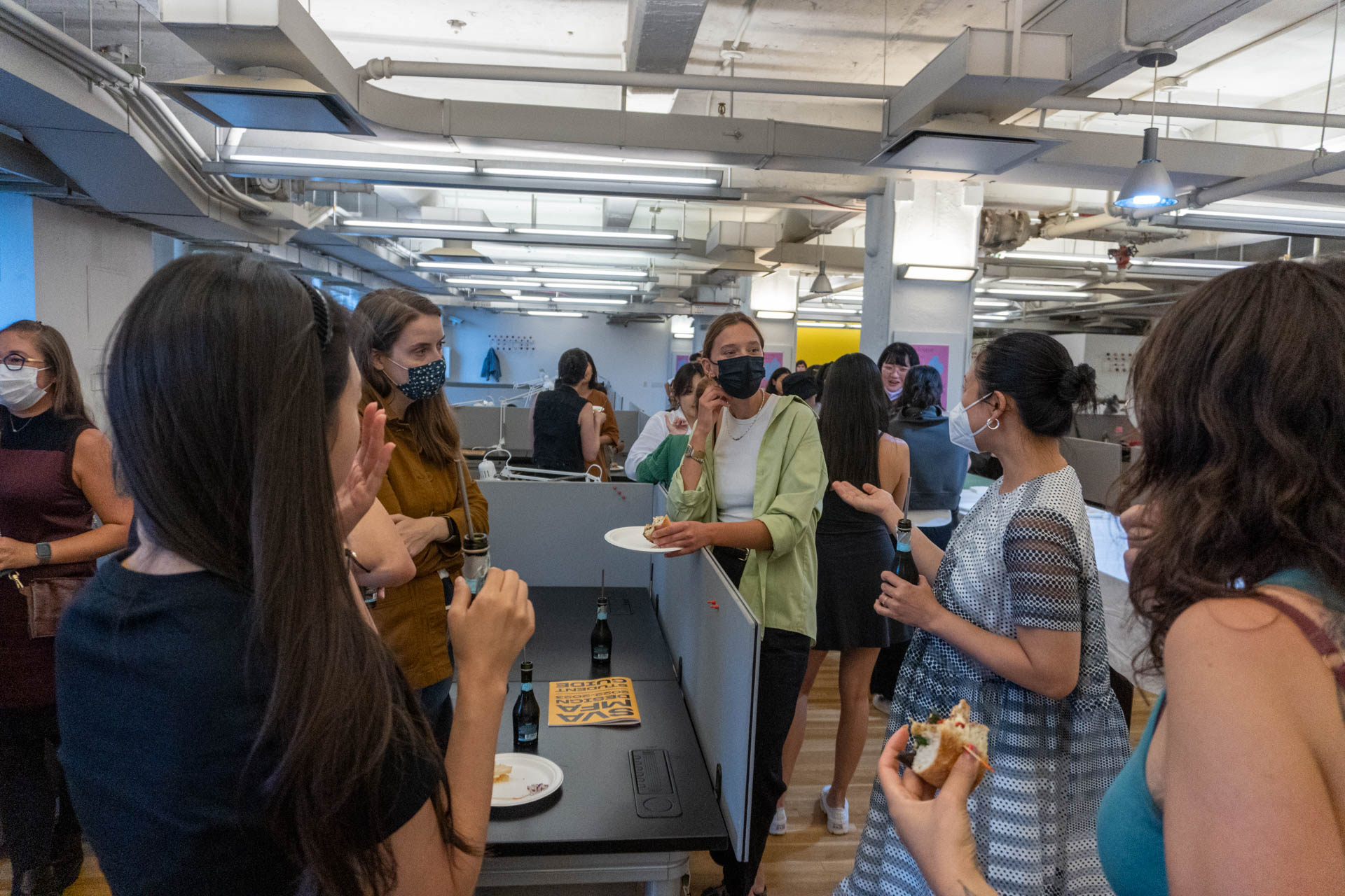 students gathered around a table corner