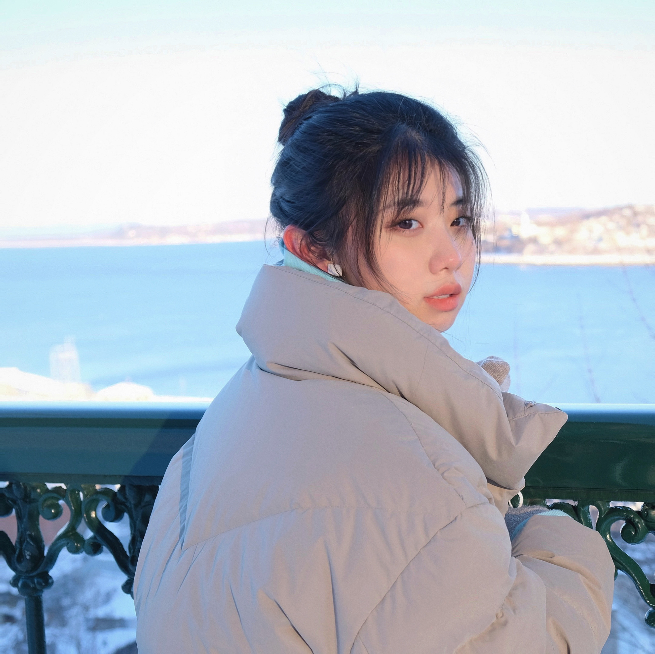 Asian Woman with jacket by the sea