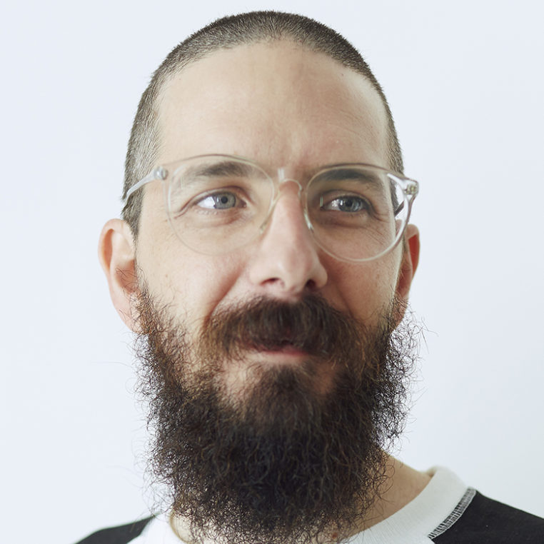 man with transparent glasses and beard on white background