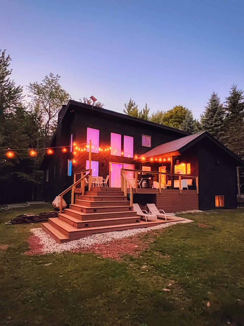 house in the woods with lights