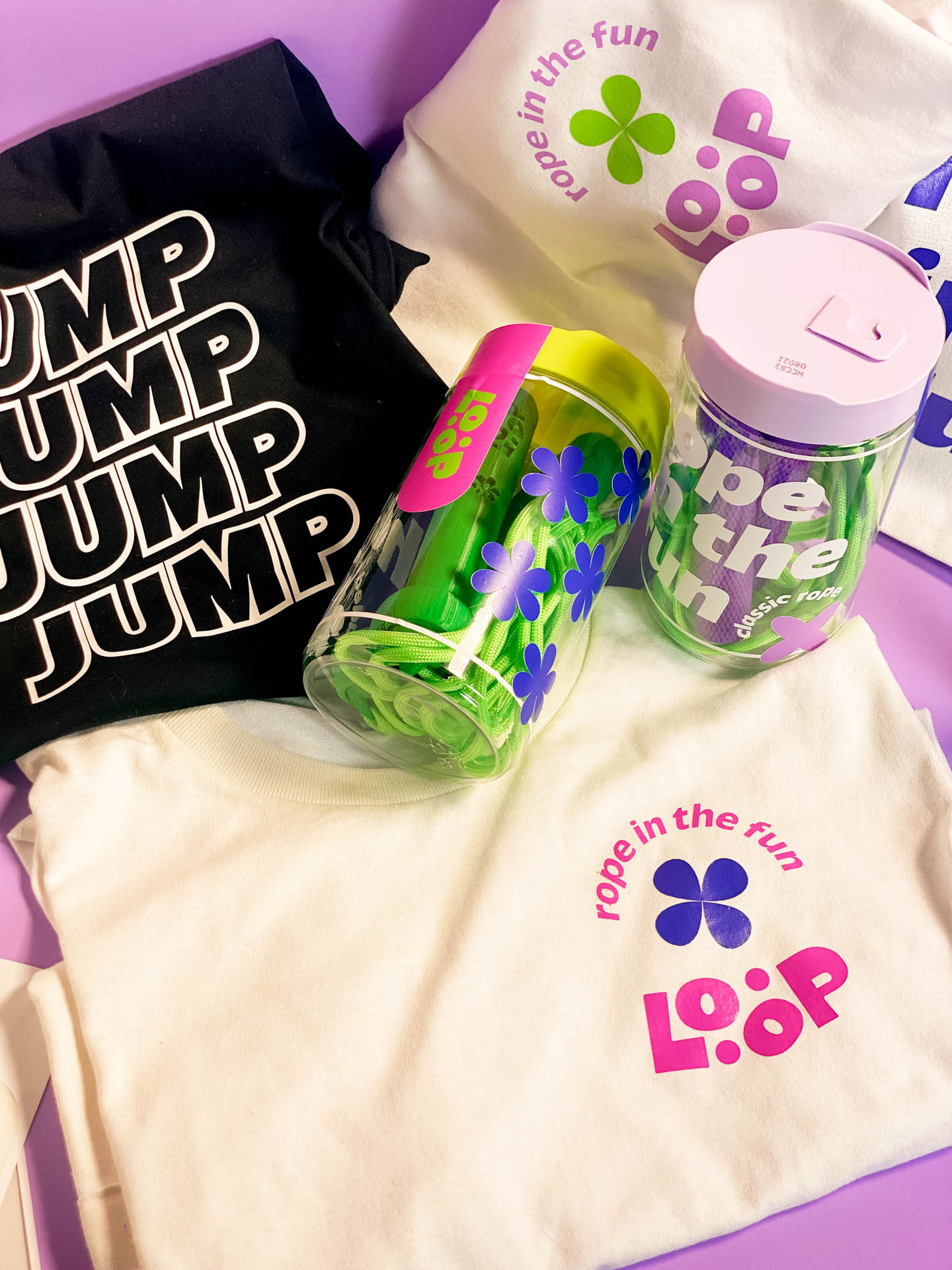 shirts and bags with the loop logo, two jump ropes in clear vials