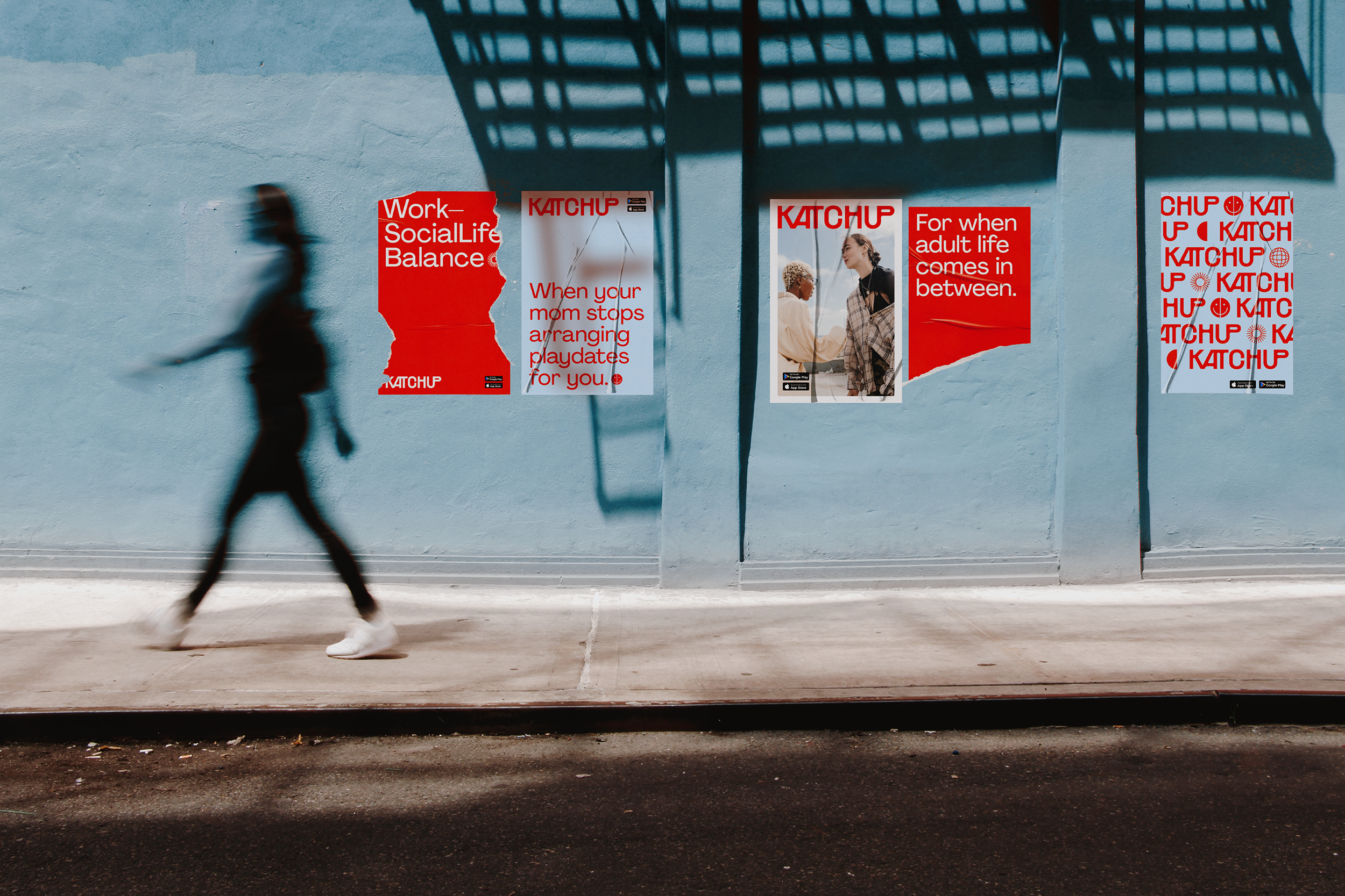 a person walking by wall posters showing the Katchup app promotion