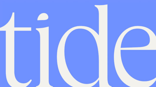 the Tide logo in white against a blue background