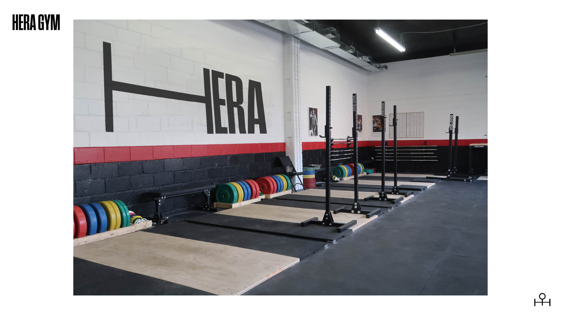 interior of weight room/gym with Hera logo on wall