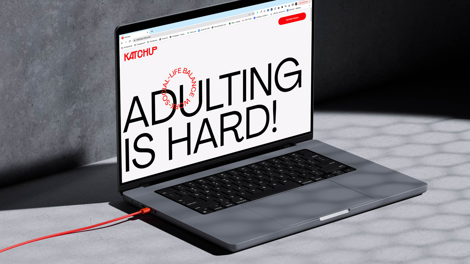 on the ground,  a laptop open to the Katchup app