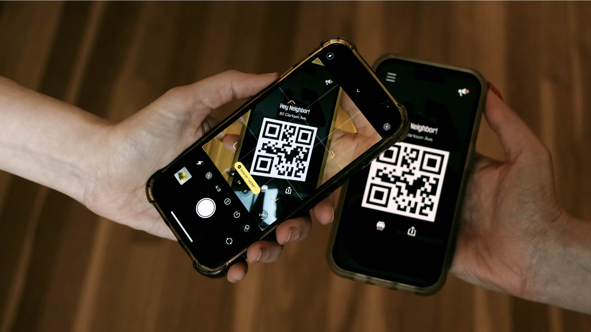 two iphones showing QR codes