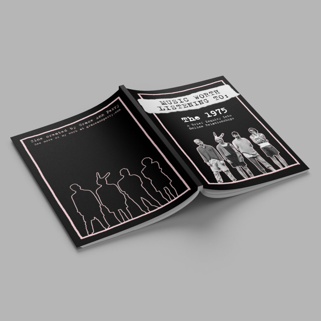 magazine with black and pink design laying on grey background