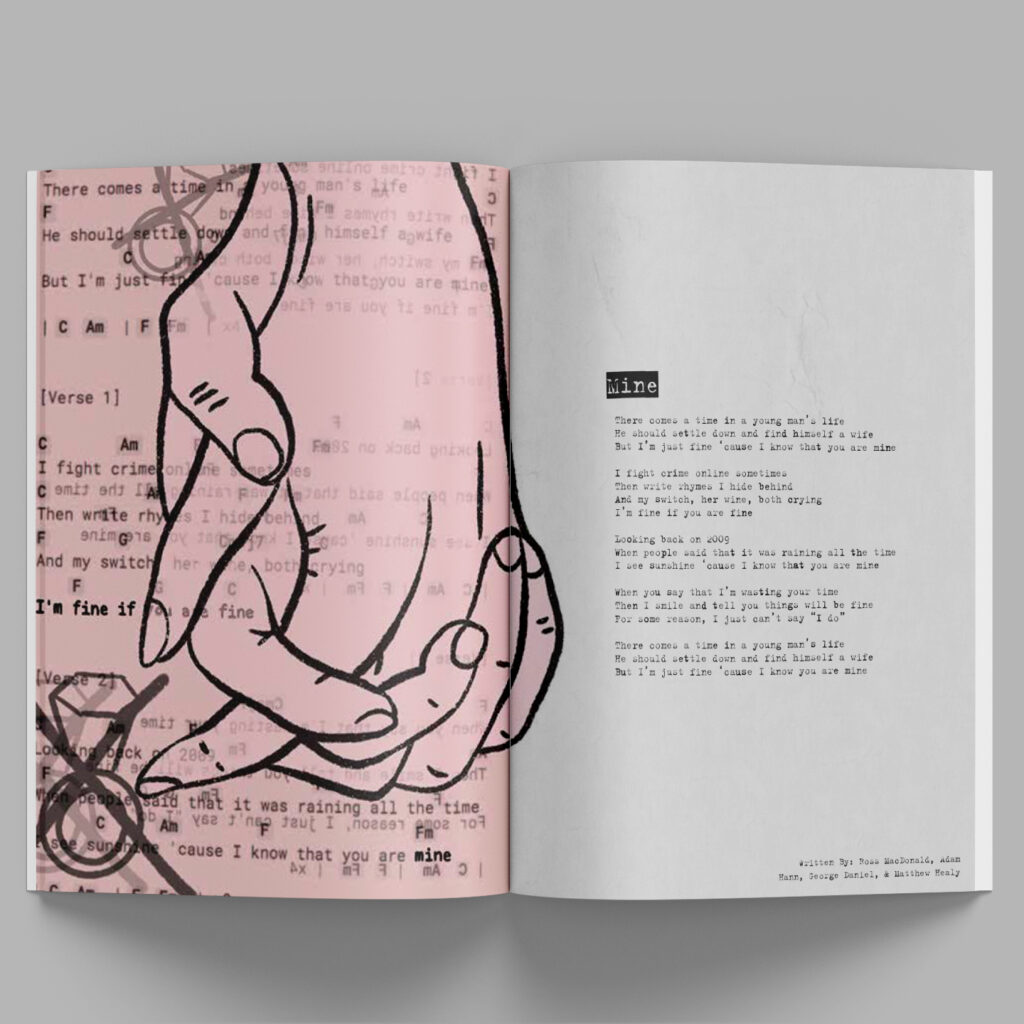 magazine with black and pink design laying on grey background, illustration of holding hands