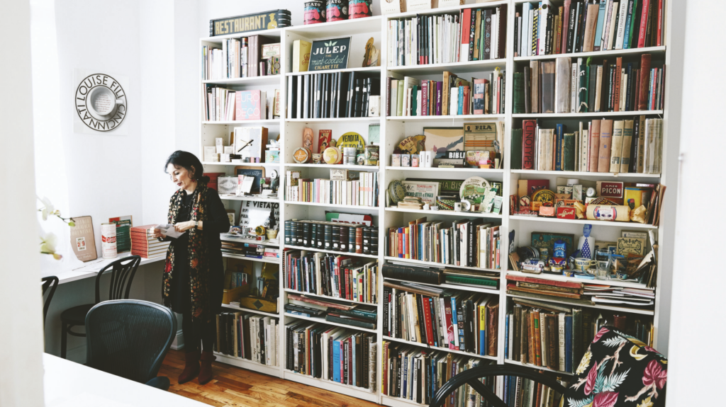 Louise Fili in her studio with bookcase