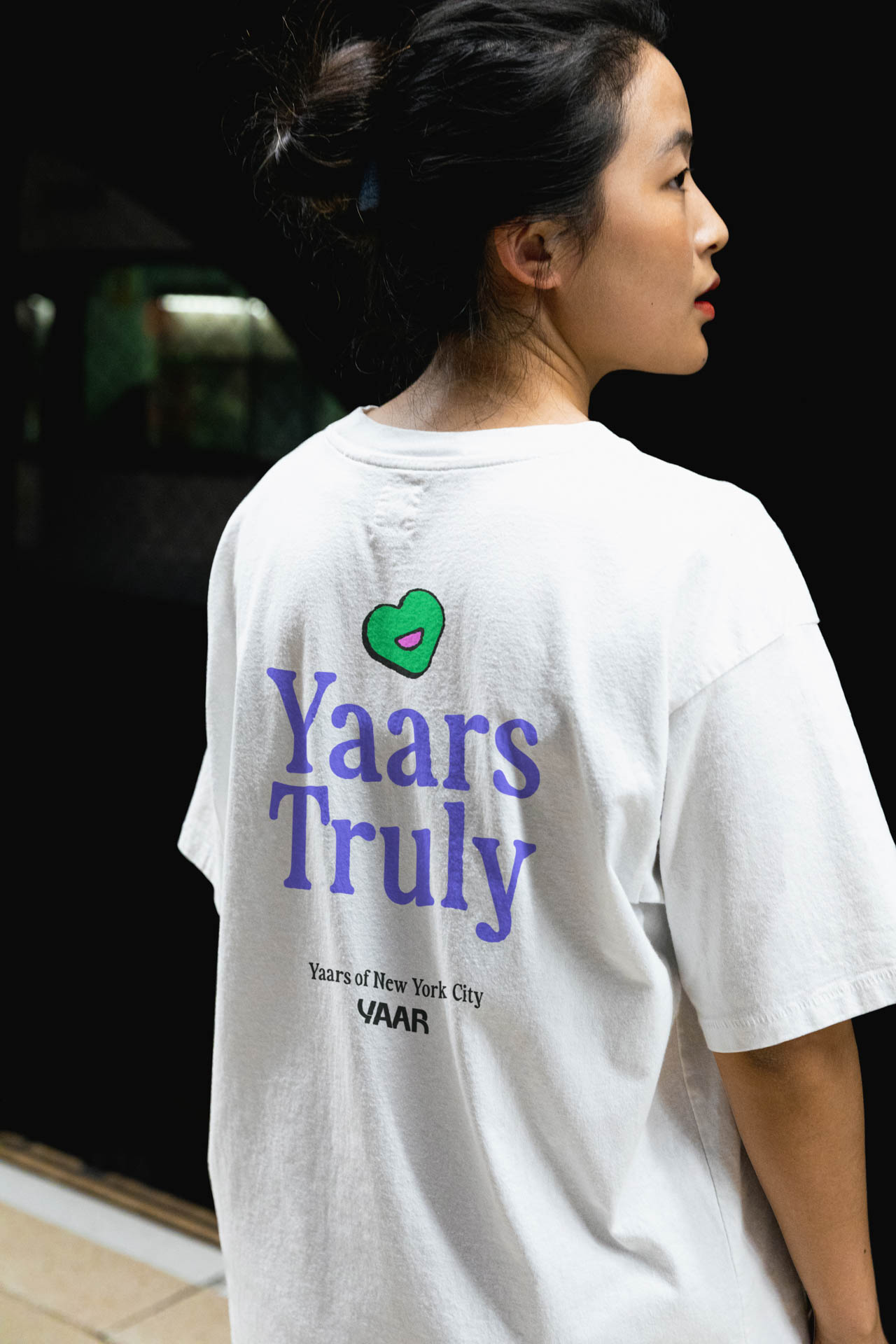 woman wearing a white tshirt with the logo for Yaar venture