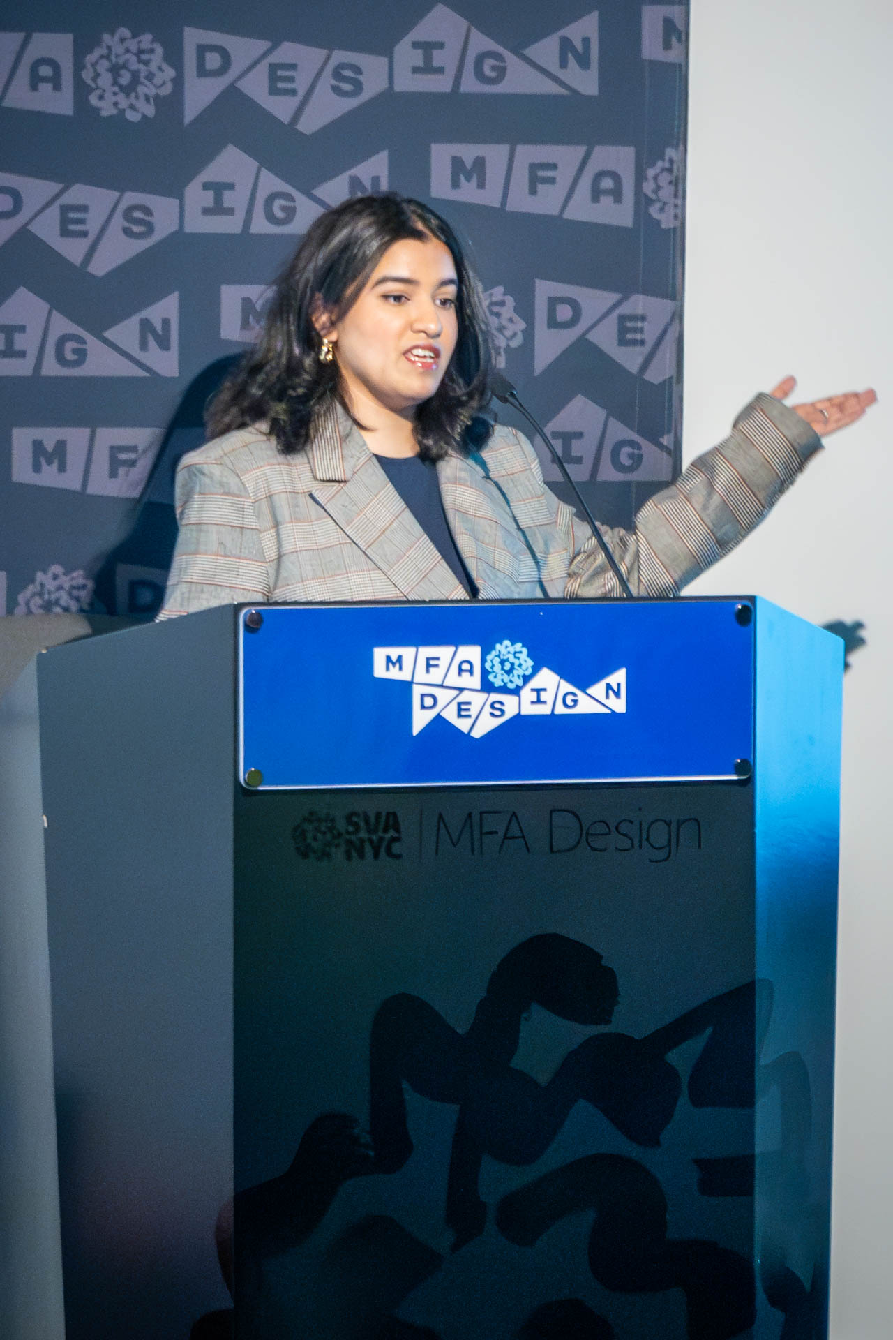 student at a podium giving a presentation