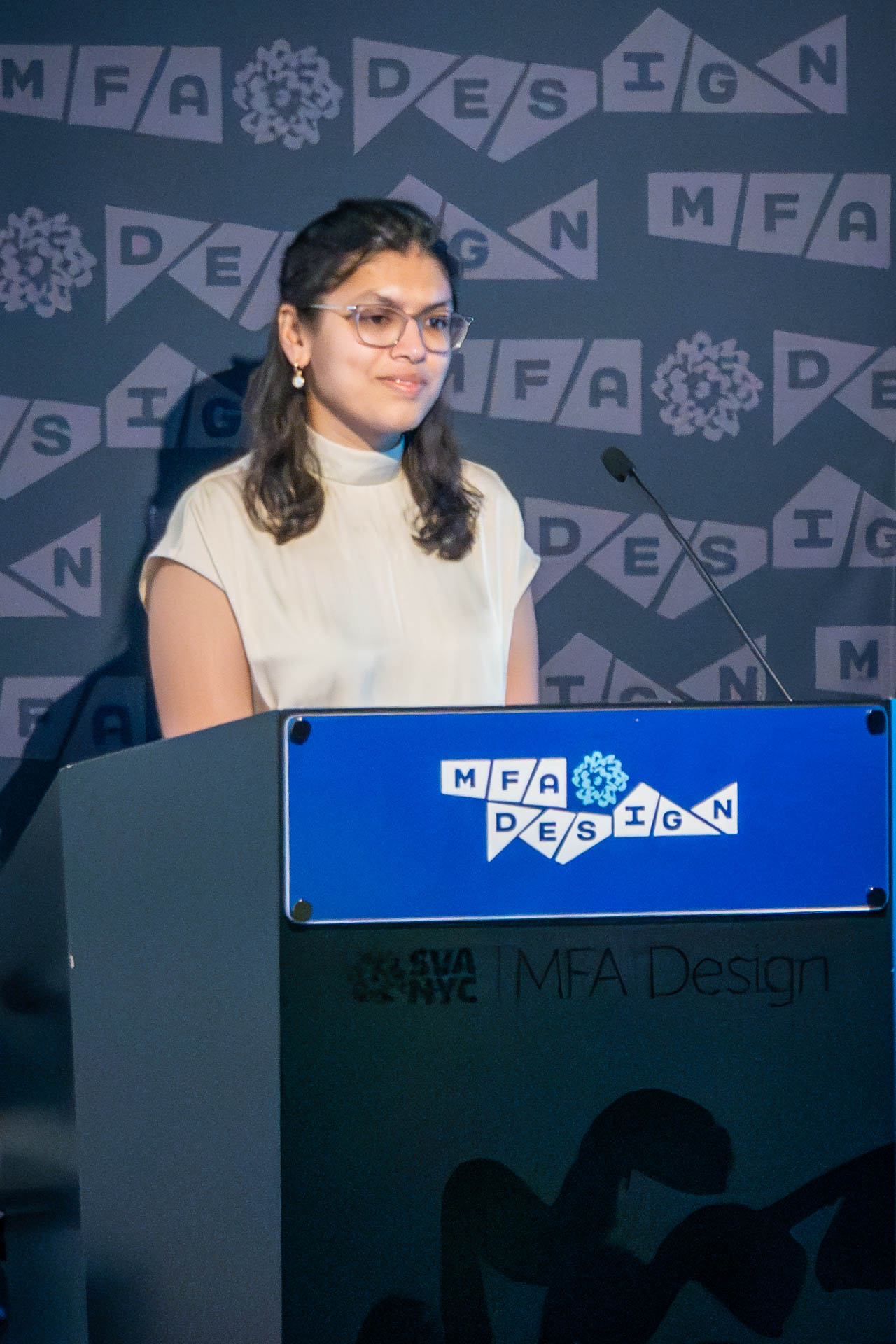 student at a podium giving a presentation