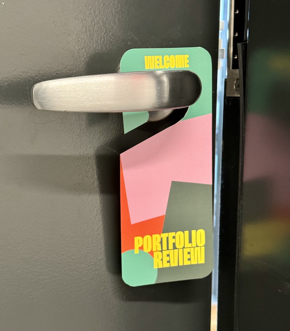 door handle with sign saying Welcome Portfolio Review