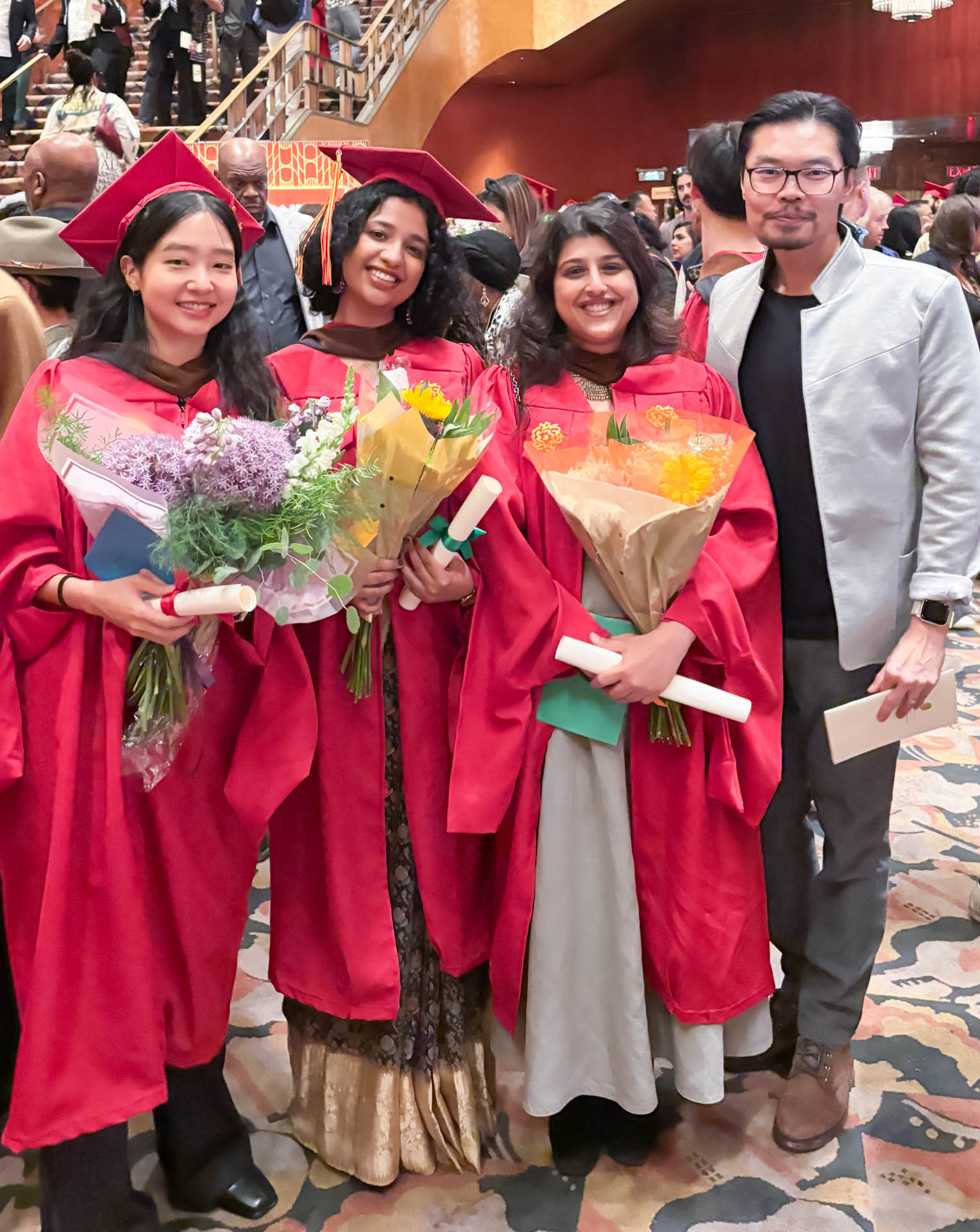 several students in their graduation gowns