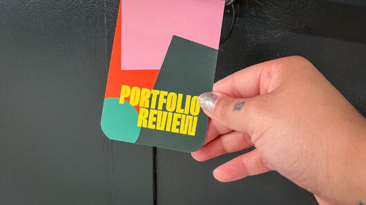 a door handle sign about the portfolio review