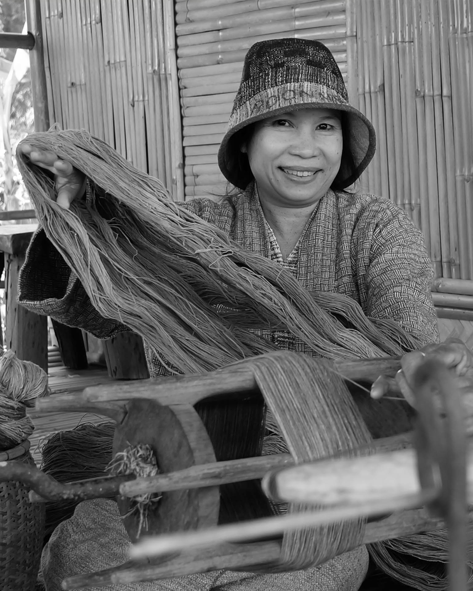 a Thai woman making fabric