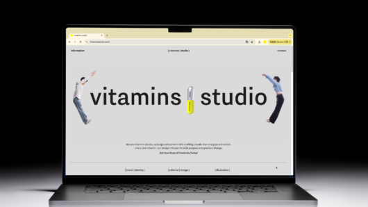 a laptop open to a webpage that says Vitamins studio